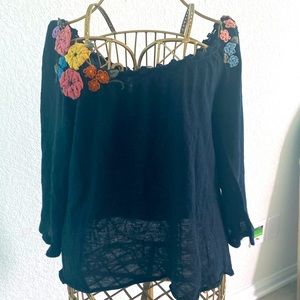 Off the shoulder sweater from Anthropologie’s with embroidery flowers